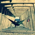 A wondrous hammock under a concrete pier on Tybee Island - GEORGIA - USA Royalty Free Stock Photo